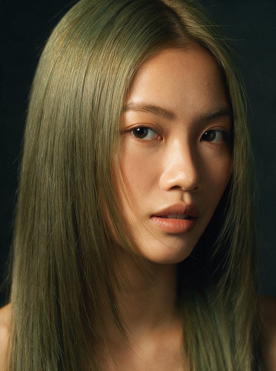 Muted olive-mint colour on long straight hair
